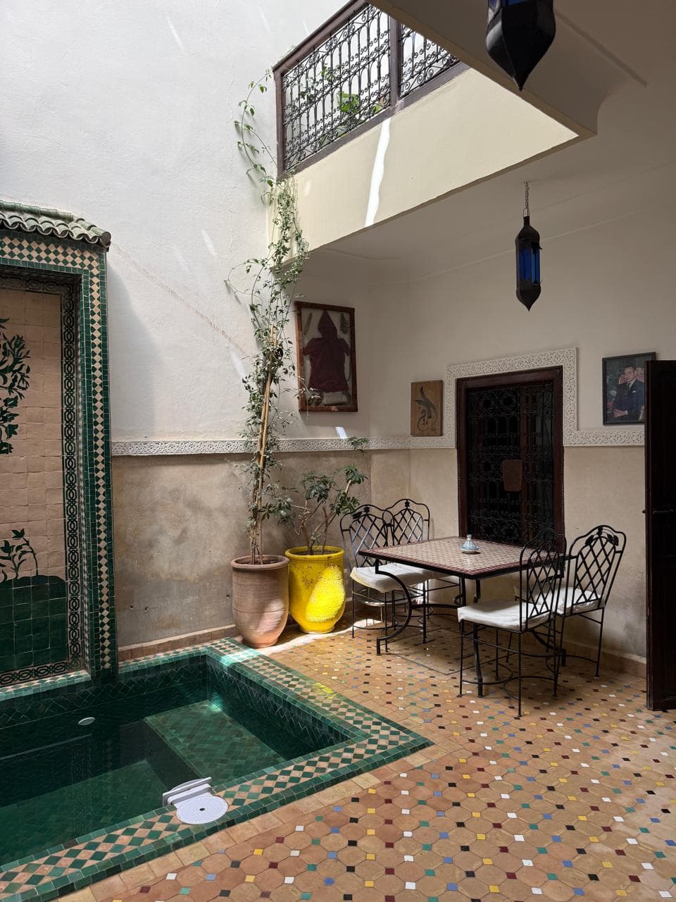 Cozy riad bedroom with traditional moroccan fabrics