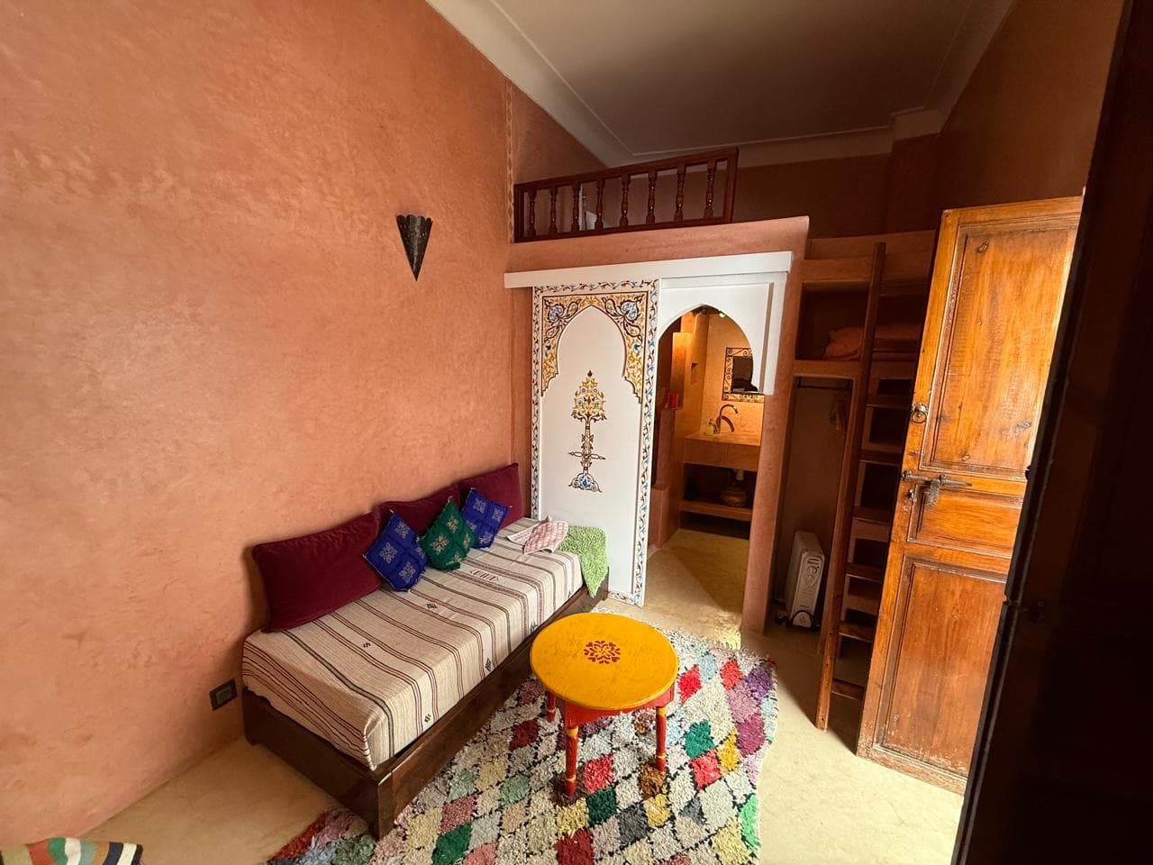 Moroccan bedroom suite with colorful textiles