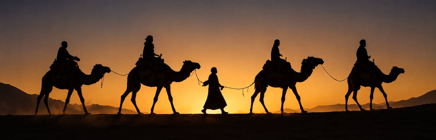 Silhouetted camels in Moroccan desert camp during sunset