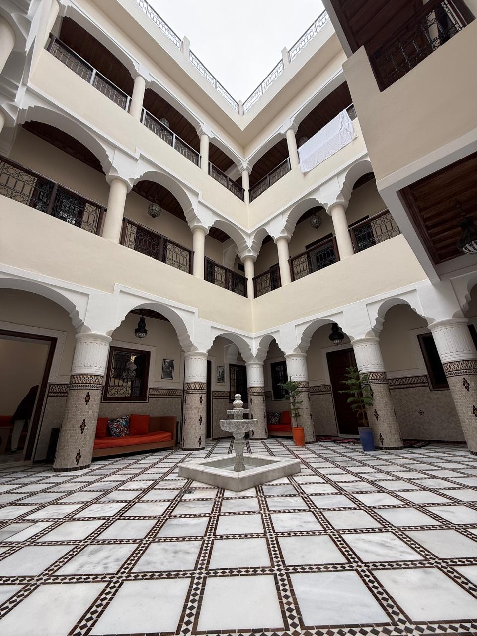 Riad interior courtyard with marble fountain Marrakech